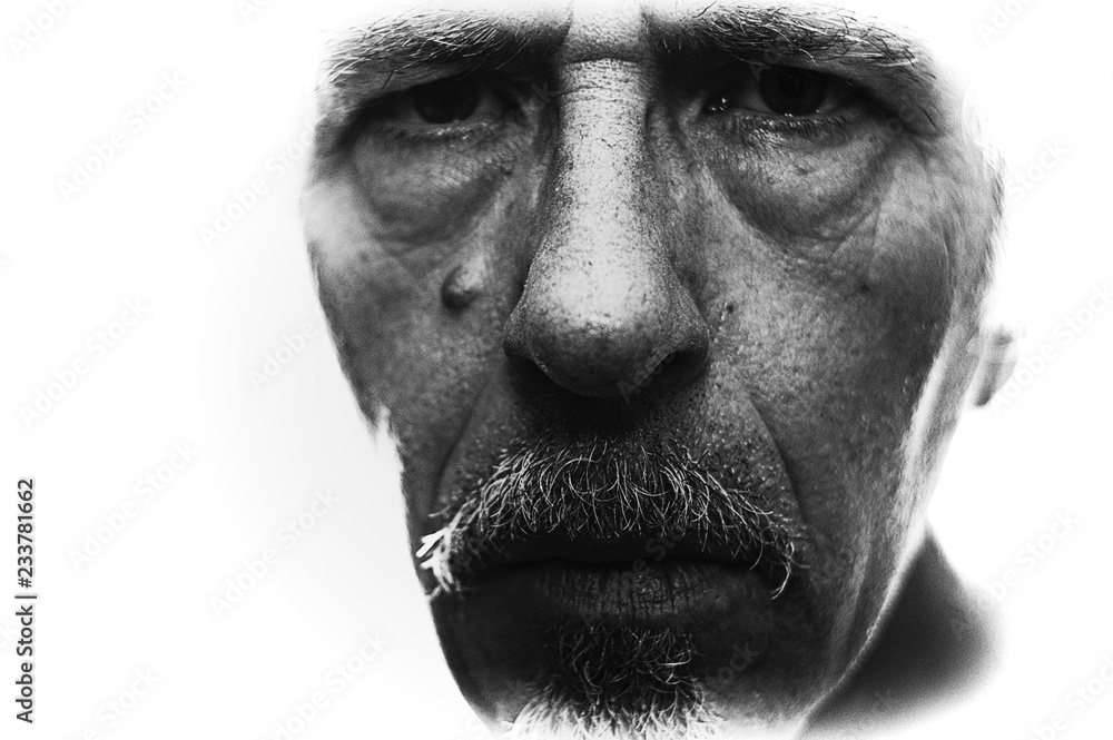 Obraz premium Extreme close up of man's face, backlit with blown out edges and shallow depth of field, main focus on nose and mustache, grain visible at 100%