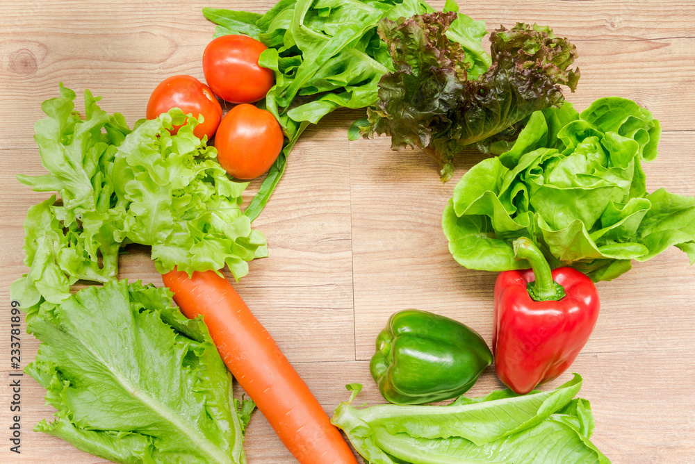 Spring Vegetable Salads on a wooden table with copy space Spring Vegetable Salads on a wooden table with copy space