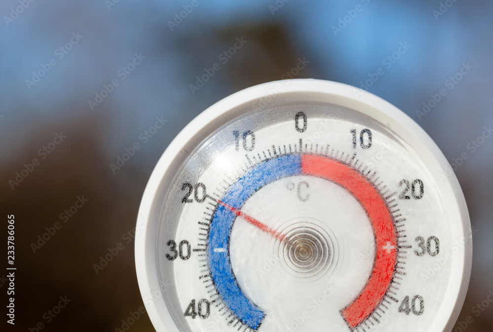 Outdoor thermometer shows frost temperature cold winter weather concept Outdoor thermometer shows frost temperature cold winter weather concept