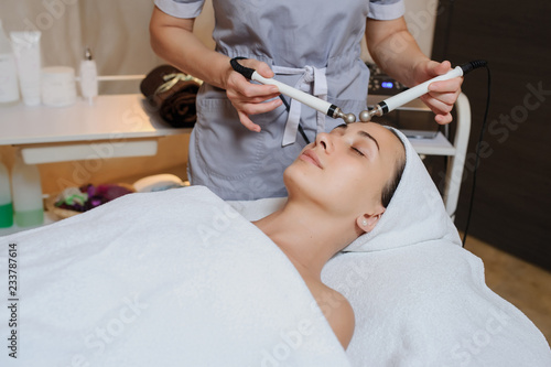 Lateral view of woman facial massage