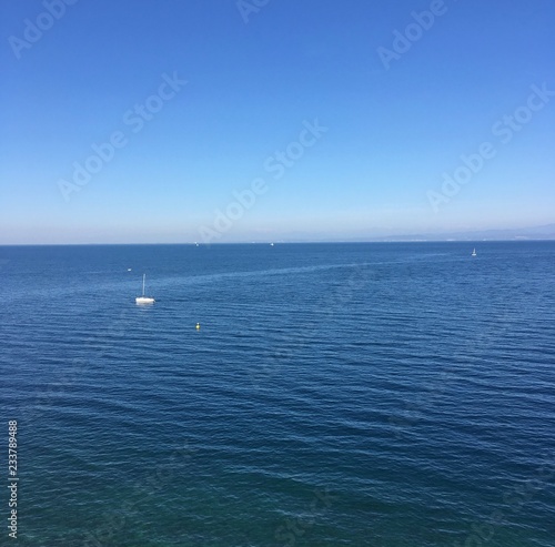 Seascape with clear blue sky.