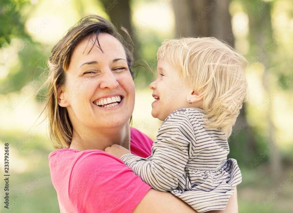 Cute young child hug her mom Cute young child hug her mom
