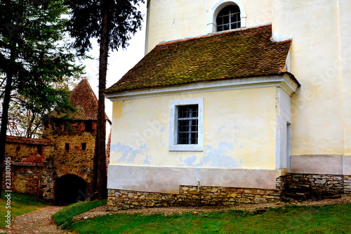 Courtyard of the medieval fortified saxon church in the village Crit-Kreutz, Transylvania, Romania photo