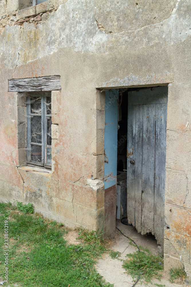 Fototapeta premium Gates or doors of the farms in the hamlet of Durat in France (Auvergne). Durat was once a factory village belonging to the Pionsat castle.