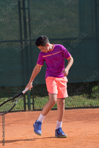 Young tennis player prepares for serving © cirkoglu