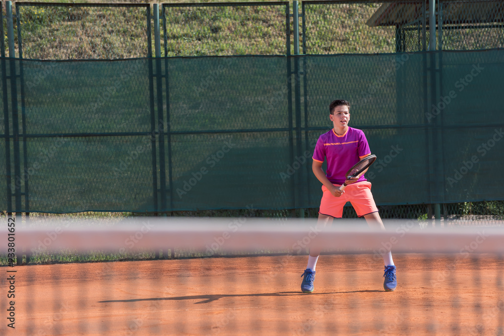 Young tennis player prepares for receiving the servis Young tennis player prepares for receiving the servis