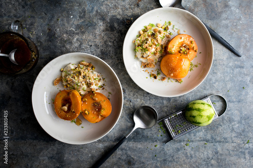 Overhead view of poached apricots with pistachio and amaretto mascarpone 