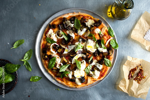 Overhead view of pizza served on plate