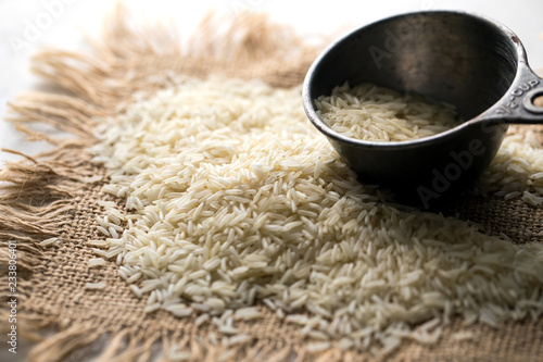 Close up of uncooked basmati rice on burlap photo