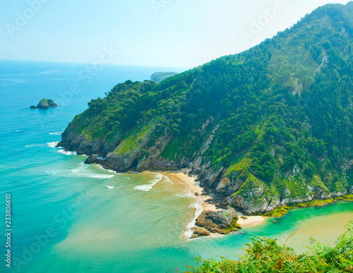 Secluded beach surrounded by amazing cliffs, Estuary of Tina Minor in Cantabria photo