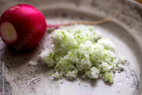 Close up of radish with sweet lime salt in plate photo