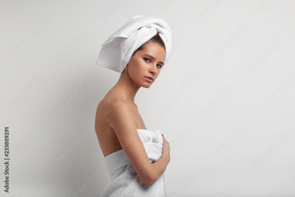 close up portrait of young hispanic woman with towel on head only, beauty concept close up portrait of young hispanic woman with towel on head only, beauty concept