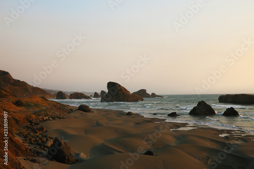 Beautiful sandy beach with cliffs on the Pacific coast