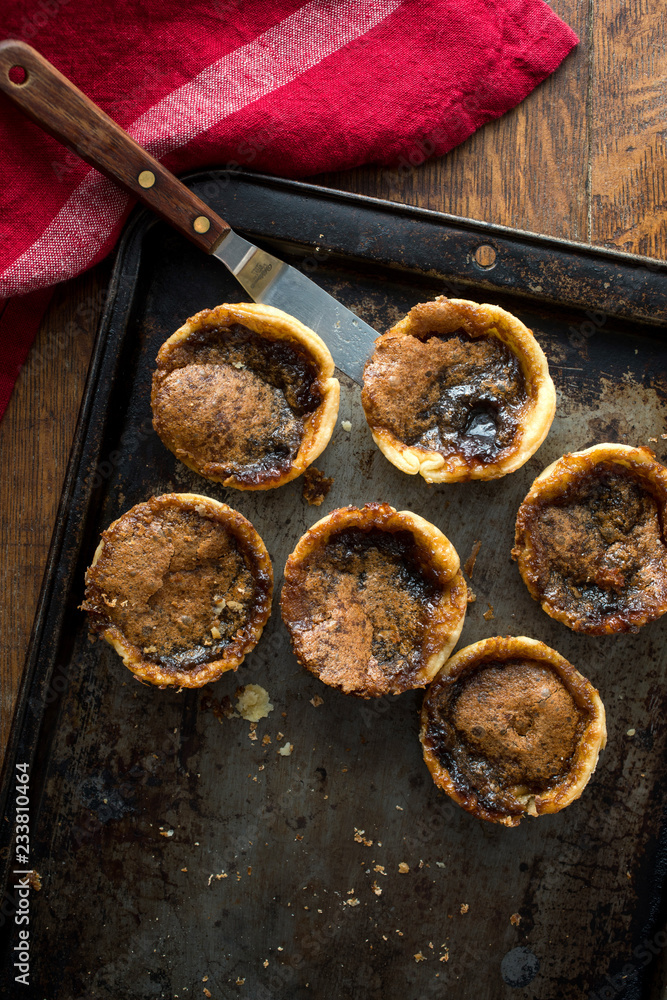 Overhead view of butter tart on baking tray Overhead view of butter tart on baking tray