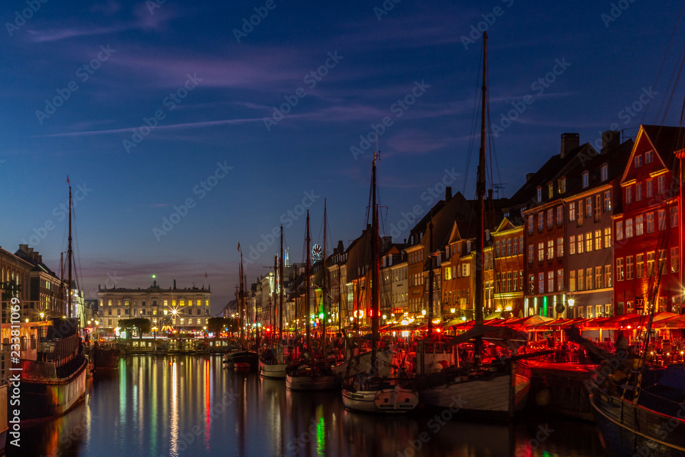 Sunset in Copenhagen on the old, colorful and busy harbor of Nyhavn