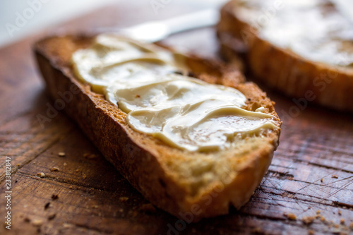 Close up of cheese spread on toasted bread photo