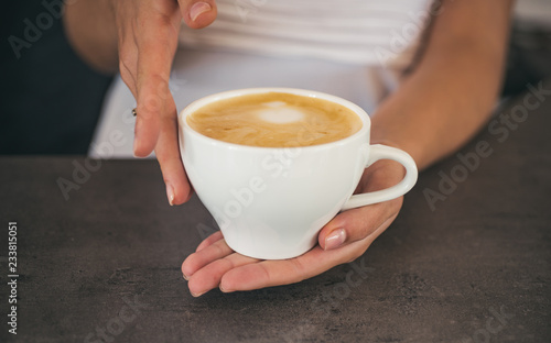 barista propose americano or espresso cup. relax in cafe or coffee shop and drinking. perfect morning with best coffee. fresh morning coffee with milk and cream froth. Five minutes for coffee