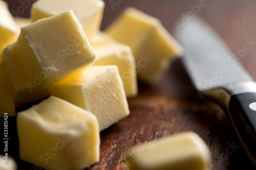 Close up of butter cubes on cutting board