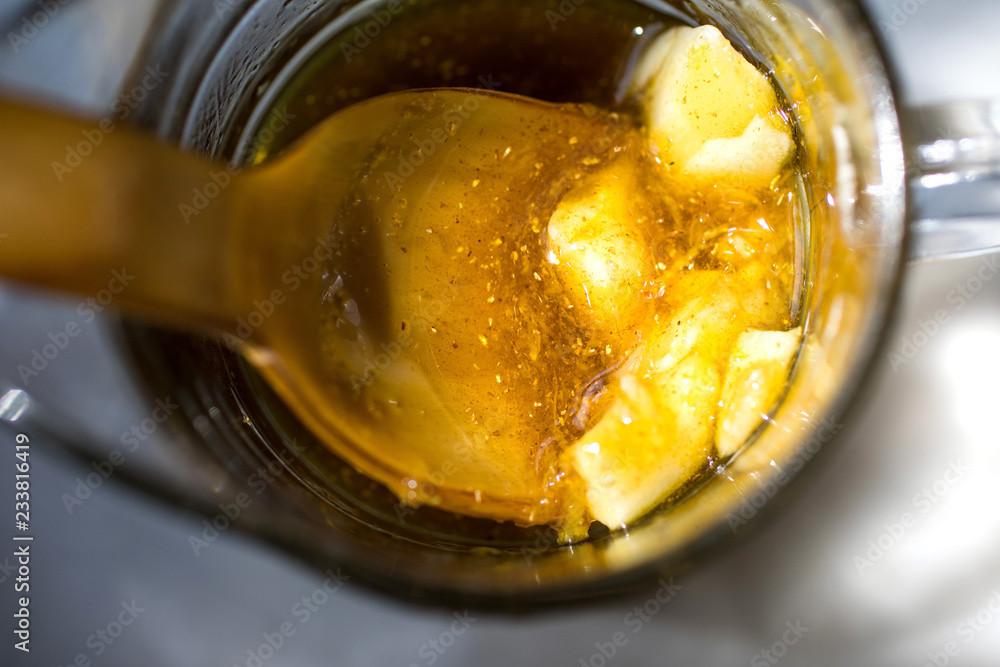 Close up butter and spoon in jar Close up butter and spoon in jar