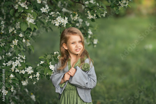 Portrait of a little girl in spring in flowering trees 1805.