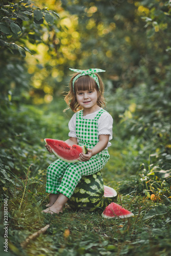 Smiling child with a piece of juicy watermelon in his hands 1898.