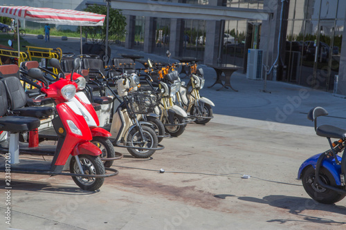 Public Bicycles and Electric tricycle scooters are available for people to borrow or rent for short distance ride