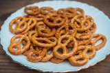 salted mini pretzels in the traditional looped knot shape on white plate
