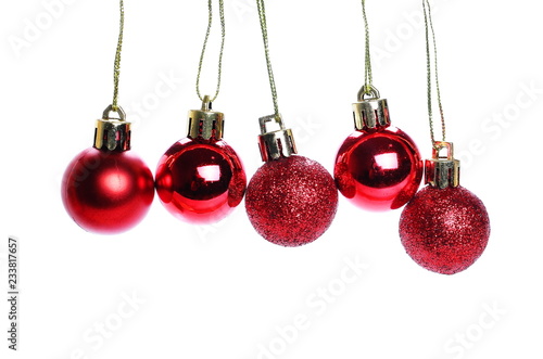 Red Christmas balls hanging isolated on white background