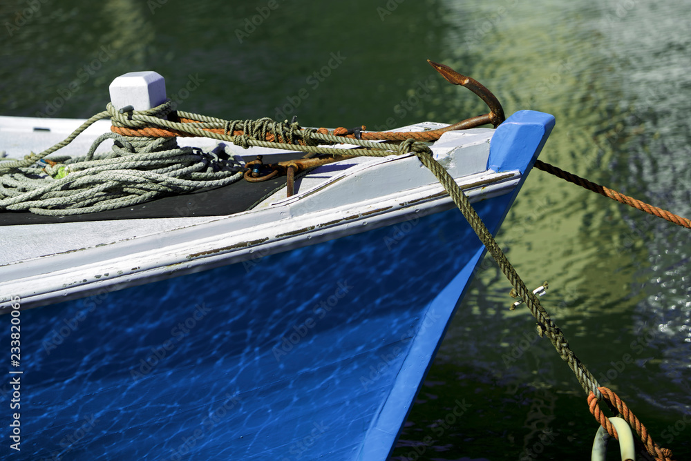 Wooden boat with reflection
