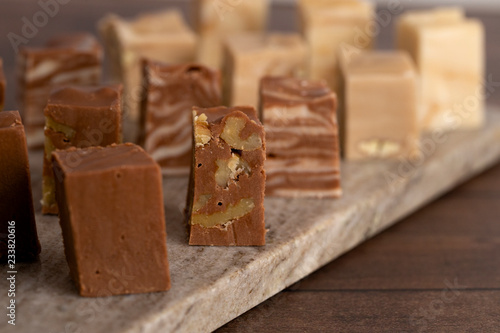 Six Different Flavors of Fudge on a Wooden Table