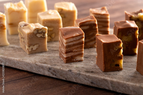 Six Different Flavors of Fudge on a Wooden Table