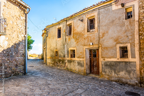 Paved street and in the background the Medinaceli field. Soria Castile and León Spain