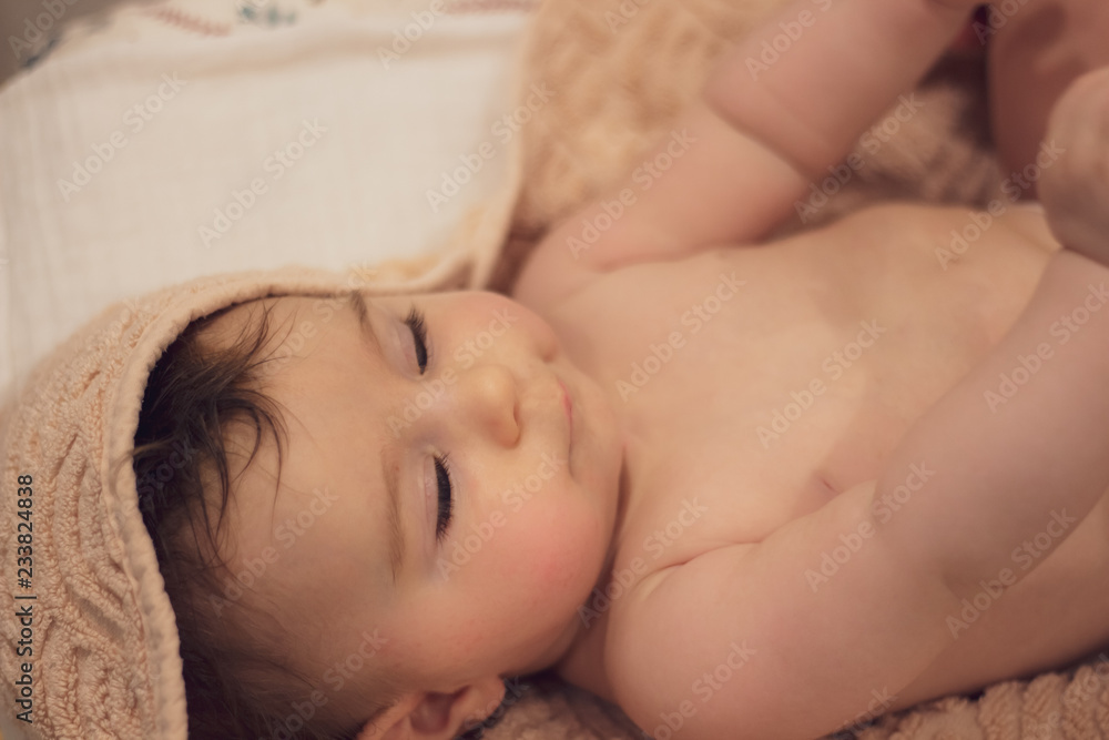baby in towel after taking a bath baby in towel after taking a bath