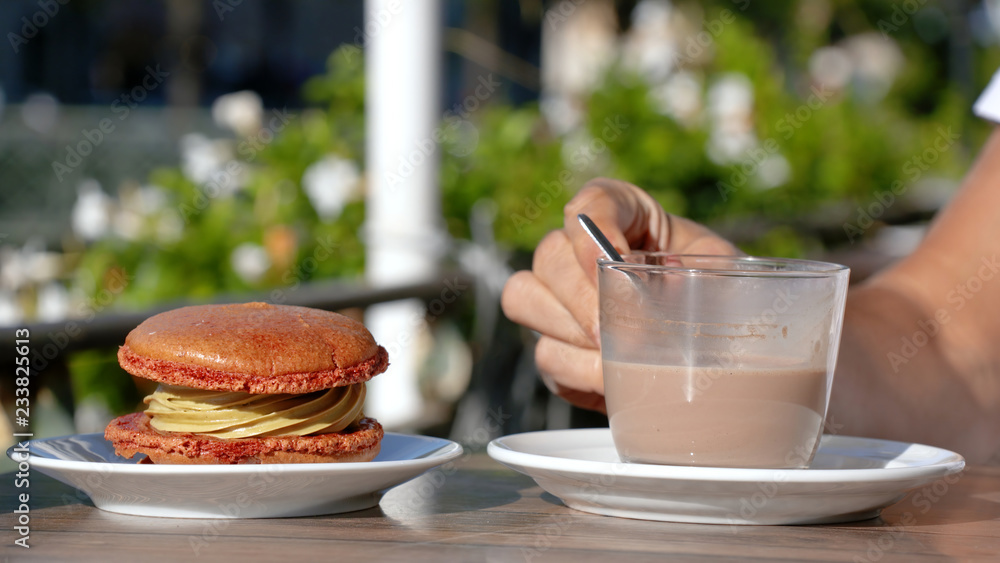 macaron and hot chocolate on a terrace