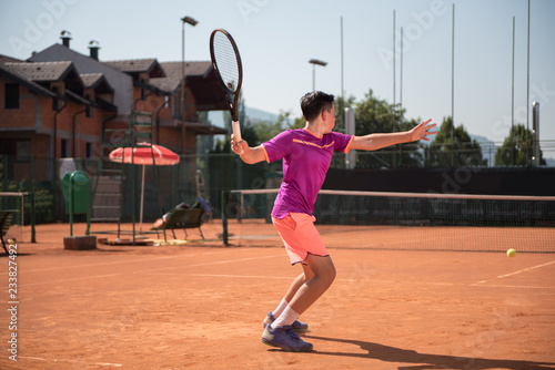 Young tennis player playing forehand © cirkoglu