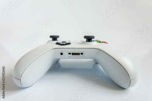 White joystick gamepad, game console isolated on white background. Computer gaming technology play competition videogame control confrontation concept. Cyberspace symbol