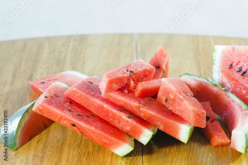 Small slices of watermelon on the kitchen table.