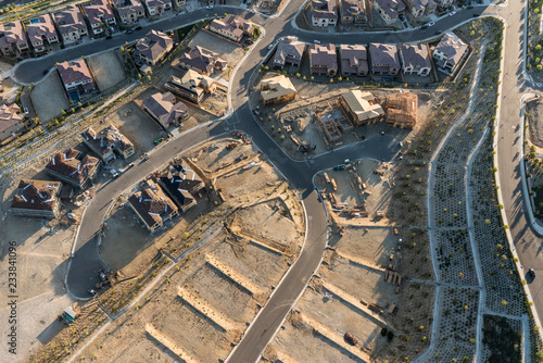 Aerial view of new streets, homes and graded lots near Los Angeles, California.