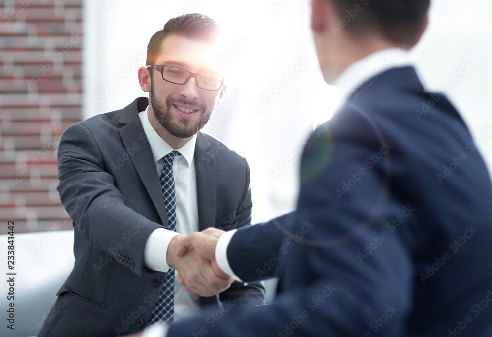 Two colleagues shaking hands after a business meeting Two colleagues shaking hands after a business meeting