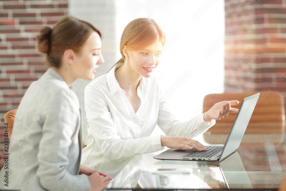 woman Manager shows the client information on the laptop. woman Manager shows the client information on the laptop.