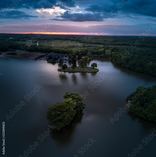 Aerial view of Sunset Dramatic Clouds of Lake and Island