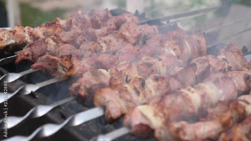 Grilling pork kebab on skewers at bbq Grilling pork kebab on skewers at bbq