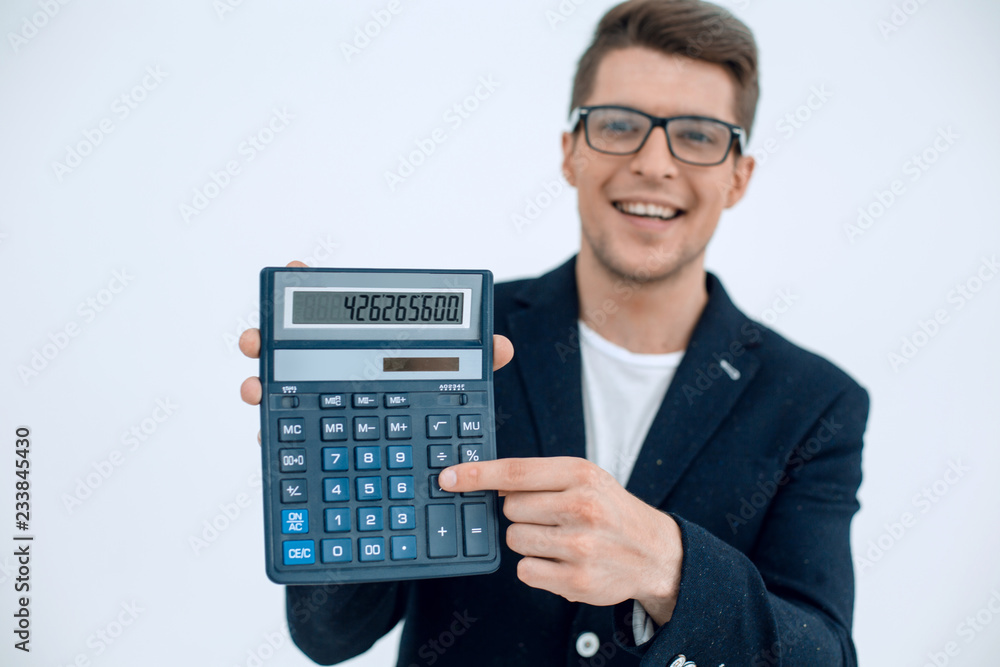 close up.smiling businessman showing calculator close up.smiling businessman showing calculator