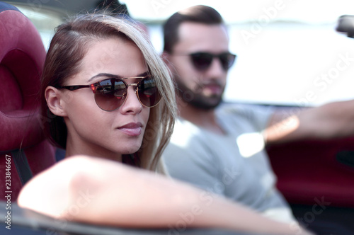 close up.modern couple sitting in a luxury car. © ASDF