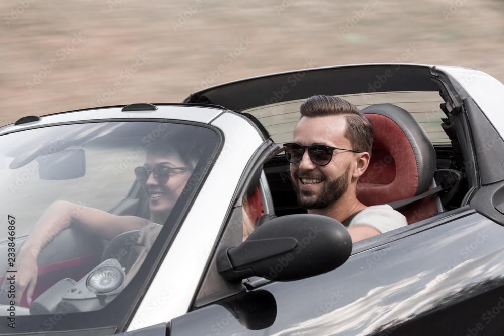 young couple in a luxury car. young couple in a luxury car.