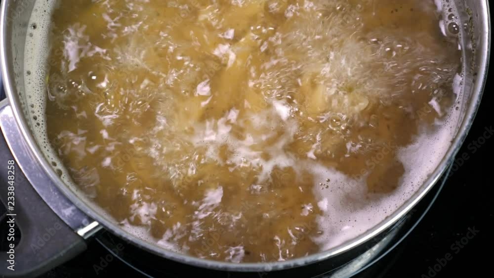 Boiling pasta in pan, cooking macaroni Boiling pasta in pan, cooking macaroni