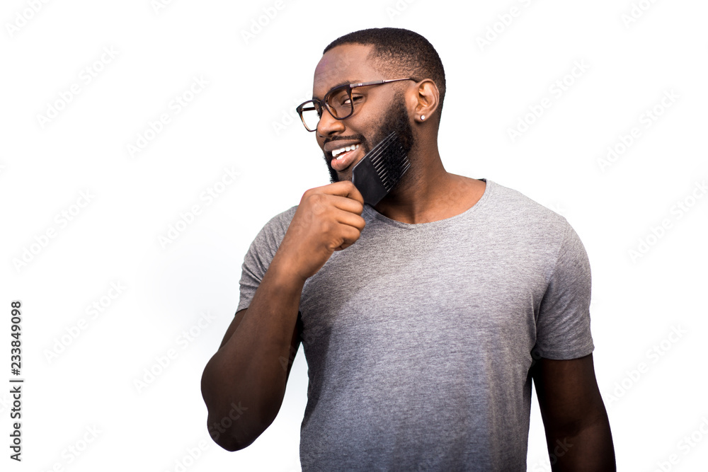 The concept of personal care, men's accessories for the care of the beard and hair, a comb for the beard, attention to detail and a desire to look good. Beauty trends and beard fashion