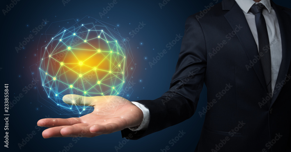 Businessman in suit holding global connection symbol on his hand Businessman in suit holding global connection symbol on his hand