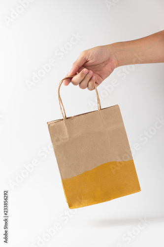 Man holding a brown paper bag