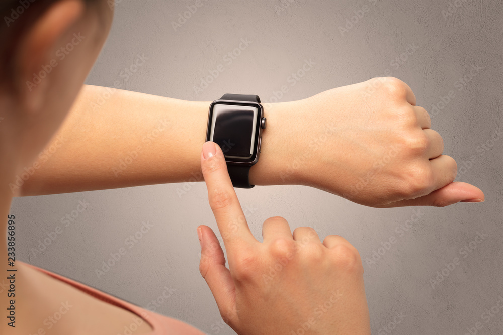 Female hand with black screen smartwatch. Female hand with black screen smartwatch.